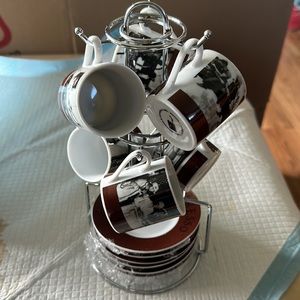 Espresso 6 piece cup and saucer with stand. New in plastic.
